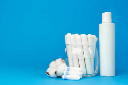 Female medical tampons and shower gel bottleの写真素材