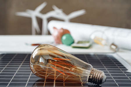 Solar energy panel and light bulb, green energy