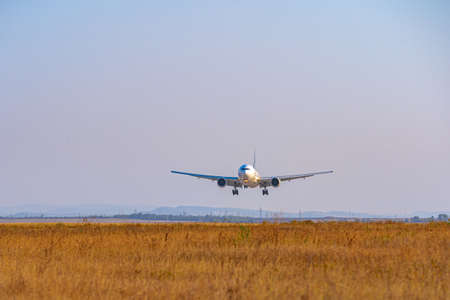 Passenger plane takes off from runway in airport