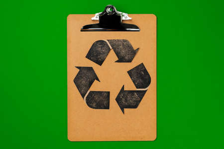 Paper recycling concept on green background top viewの写真素材