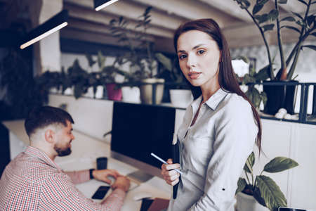 Young business people working together on project in modern officeの写真素材