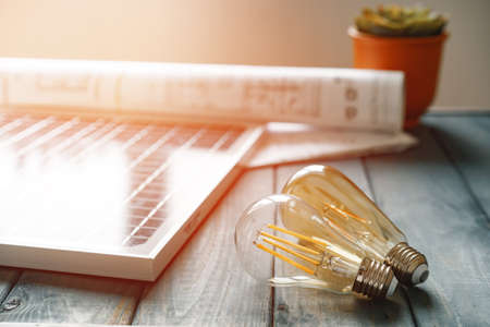 Solar energy panel and light bulb, green energyの写真素材