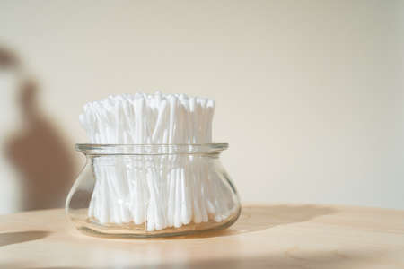 Hygienic cotton ear buds in glass cupの写真素材