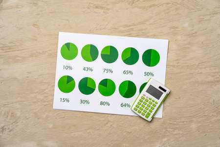 Financial paper with charts and diagrams on gray table