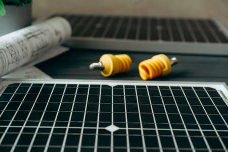 Solar energy panel and light bulb, green energyの写真素材