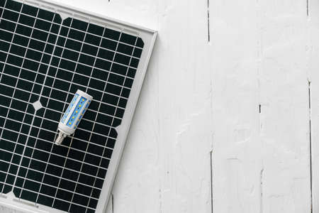 Solar energy panel and light bulb, green energyの写真素材