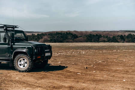 Closeup photo of off road car in mountainsの写真素材