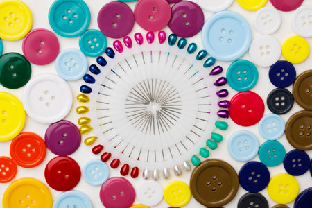 Assortment of colorful buttons on white background