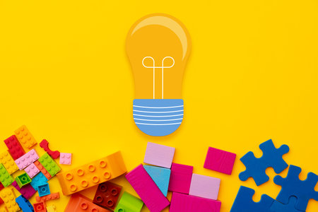 Ideas concept with light bulb and toy constructor details