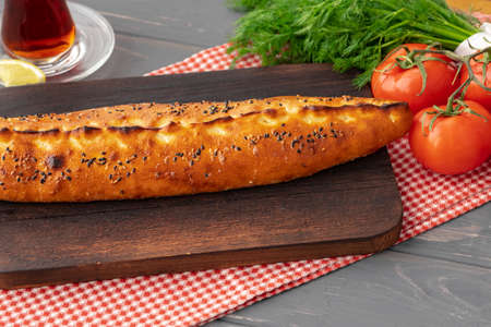 Close up of Turkish Pide bread on wooden table