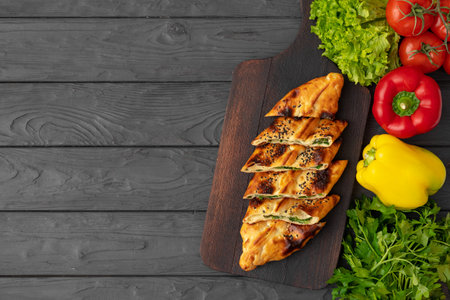 Baked homemade flatbread on wooden background close upの写真素材