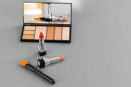 Make-up palette with colorful concealers on gray backgroundの写真素材