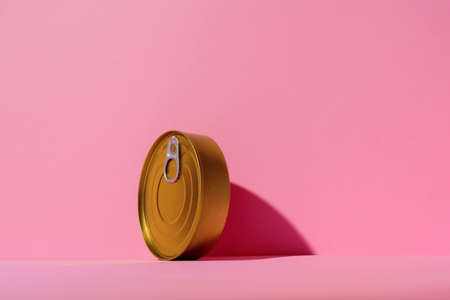Canned food tin on pink studio backgroundの写真素材