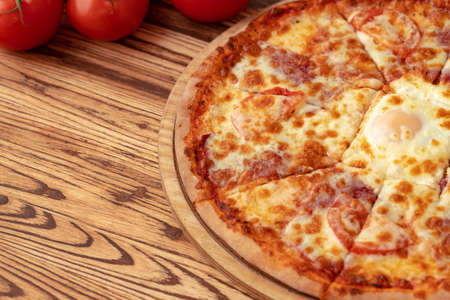 Freshly baked pizza on table close upの写真素材