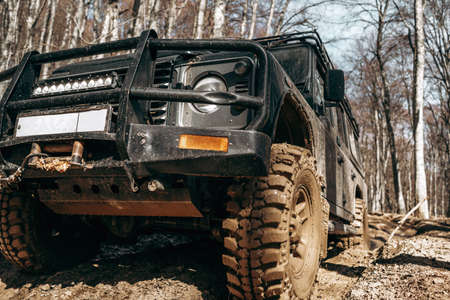 Dirty off road car on trip in forest