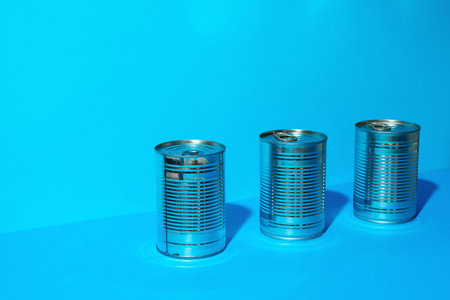 Tin can with food on blue background