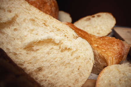 Cut bread assortment for a background, close up