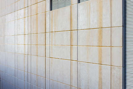Dirty gray facade made of aluminum panels