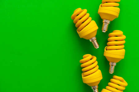 Light bulb on green paper background close upの写真素材