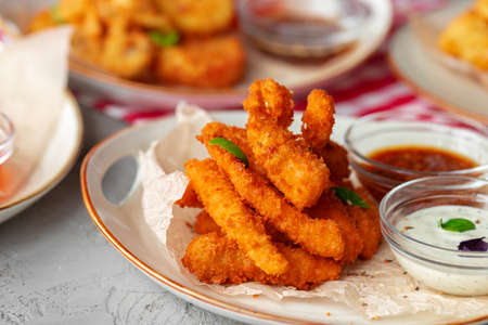 Deep fried shrimps served with sauce on plate
