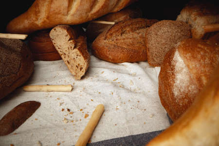 Variety of bread on tablecloth close upの写真素材