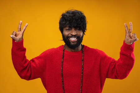 Portrait of smiling young black man in studioの写真素材