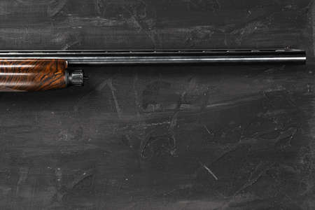 Smoothbore hunting gun on black background close up