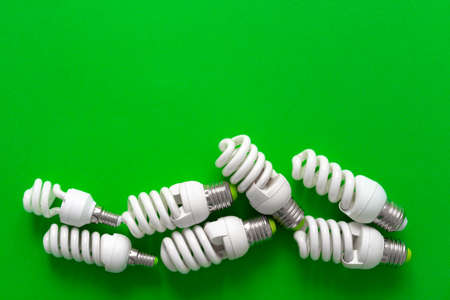Light bulb on green paper background close upの写真素材