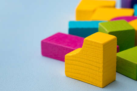 Wooden toy building kit details on blue background