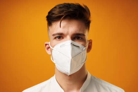 Portrait of a young man wearing face maskの写真素材