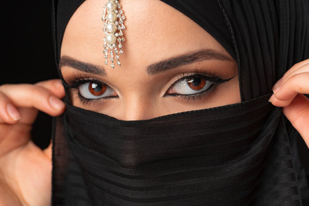 Close up portrait of beautiful muslim girl dressed in hijabの写真素材