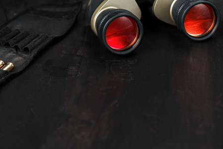 Hunting binoculars with red lense, close upの写真素材