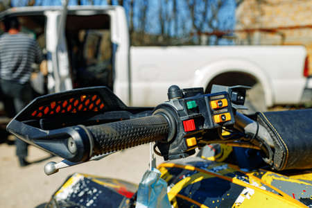 Handlebar of four-wheeled ATV quad bike close upの写真素材