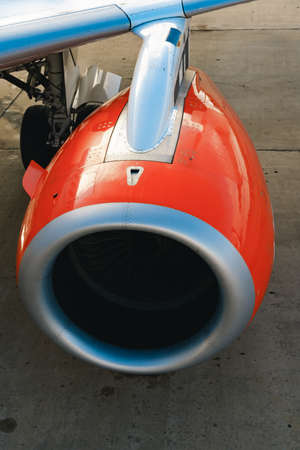 Passanger airplane turbine on runway close up