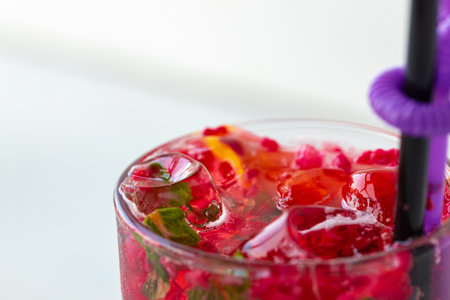 Berry lemonade with ice on white background, close upの写真素材