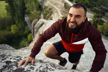 Close up of a man climbing the mountain