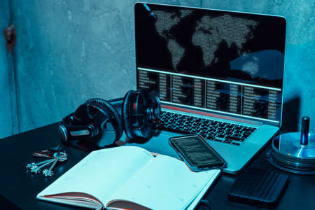 Dark working place of a programmer or hacker with computer