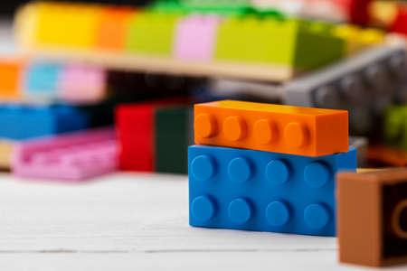 Toy building kit details on wooden backgroundの写真素材