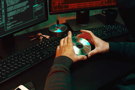 Close up of programmer of hacker hands typing a codeの写真素材