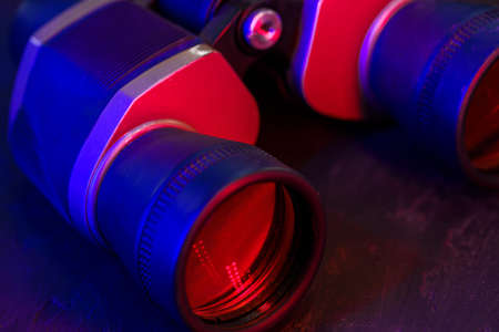 Hunting binoculars with red lense, close upの写真素材