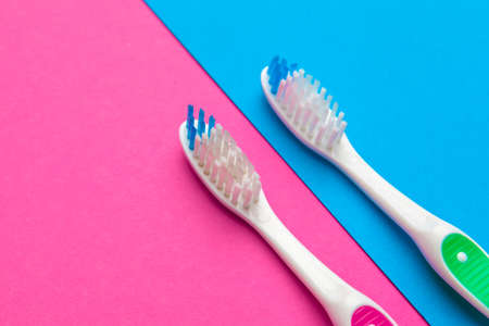 Flat lay composition with manual toothbrushes on color background, close up