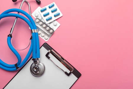 Stethoscope, clipboard and pills, closeup. Medical equipmentの写真素材