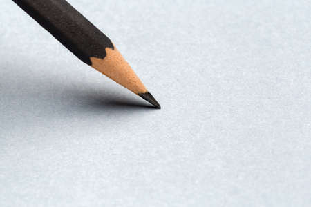 Close up Black pencil with stroke on gray paperの写真素材