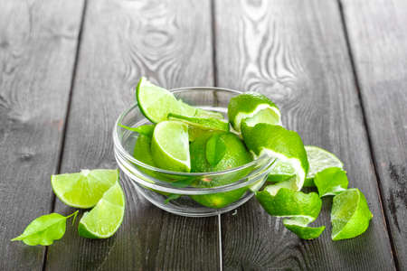 Fresh limes on wooden tableの写真素材