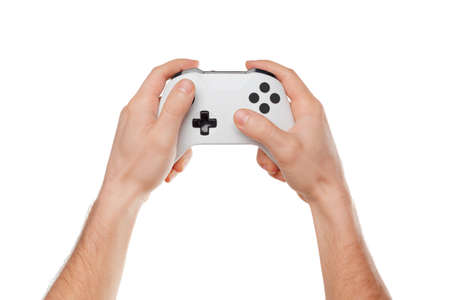 Video game console controller in gamer hands isolated on white background