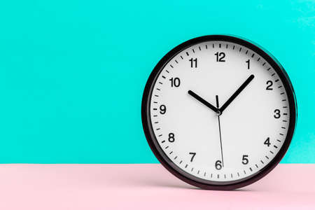 Wall Clock on color backgroundの写真素材