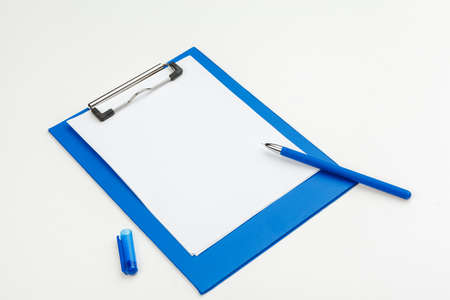Blue clipboard on office table, top view, flat lay