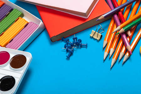 school supplies at abstract colorful background texture