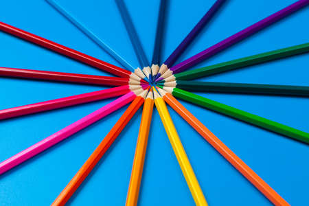 background from color pencils on blue paperの写真素材