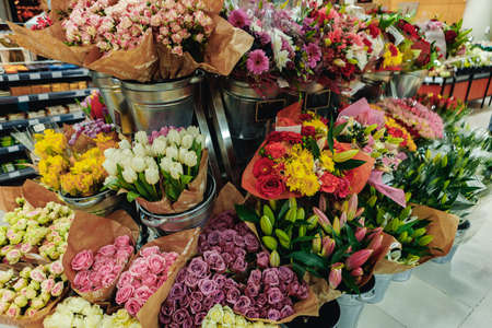 Flower bouquets on sale in a supermarketの写真素材